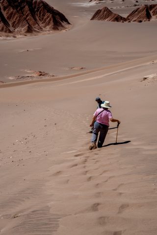 Walking down the dunes near San Pedro de Atacama, Chile