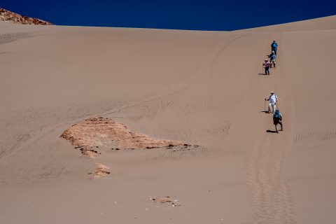 Walking down the dunes near San Pedro de Atacama, Chile