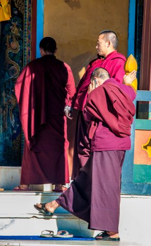 Kharchu Dratshang, monk with mobile, Bhutan