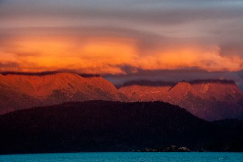 Sunset across Kachemak Bay from hotel on Homer Spit, Alaska