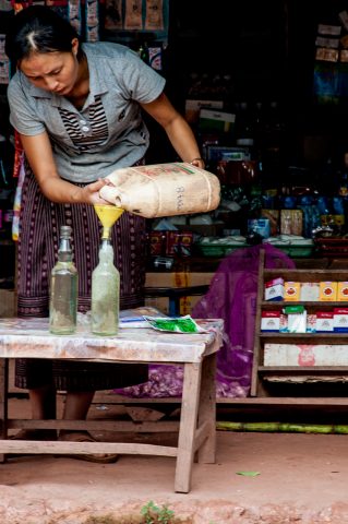 Selling petrol, Akha village, Laos
