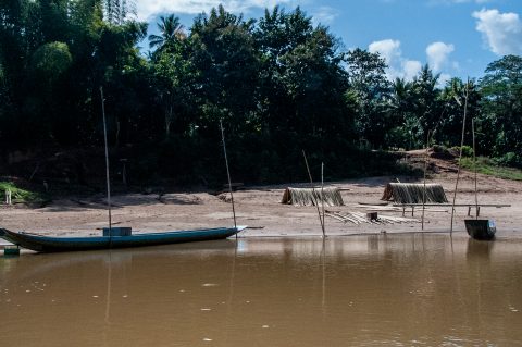 Boats moored on banks of Nam Ou River, Laos
