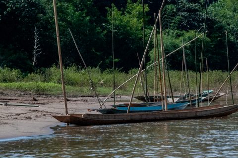 Boats moored on banks of Nam Ou River, Laos