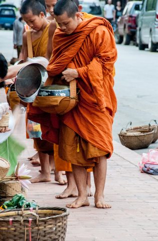 Receiving breakfast alms, Luang Prabang, Laos