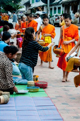 Giving  & receiving breakfast alms, Luang Prabang, Laos
