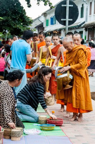 Giving  & receiving breakfast alms, Luang Prabang, Laos