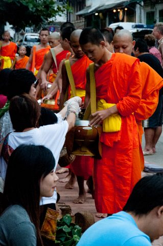 Giving  & receiving breakfast alms, Luang Prabang, Laos