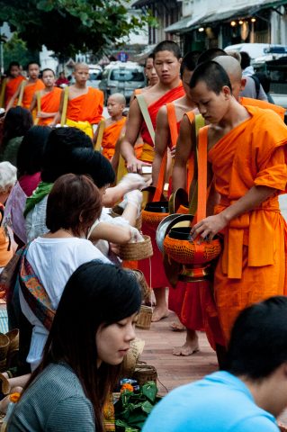 Giving  & receiving breakfast alms, Luang Prabang, Laos