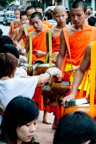 Giving  & receiving breakfast alms, Luang Prabang, Laos