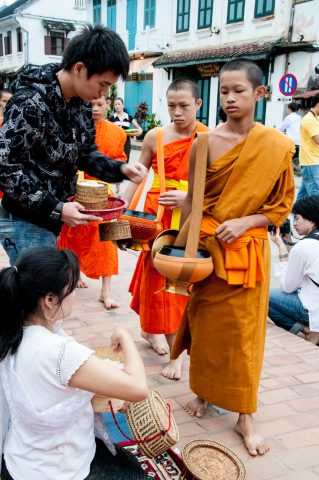 Giving  & receiving breakfast alms, Luang Prabang, Laos