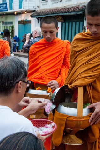 Giving  & receiving breakfast alms, Luang Prabang, Laos