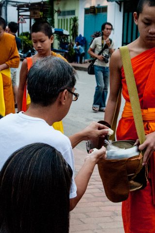 Giving  & receiving breakfast alms, Luang Prabang, Laos
