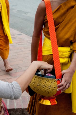 Receiving breakfast alms, Luang Prabang, Laos
